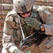 Staff Sgt. Russell Odonnell inspects a bag of coins