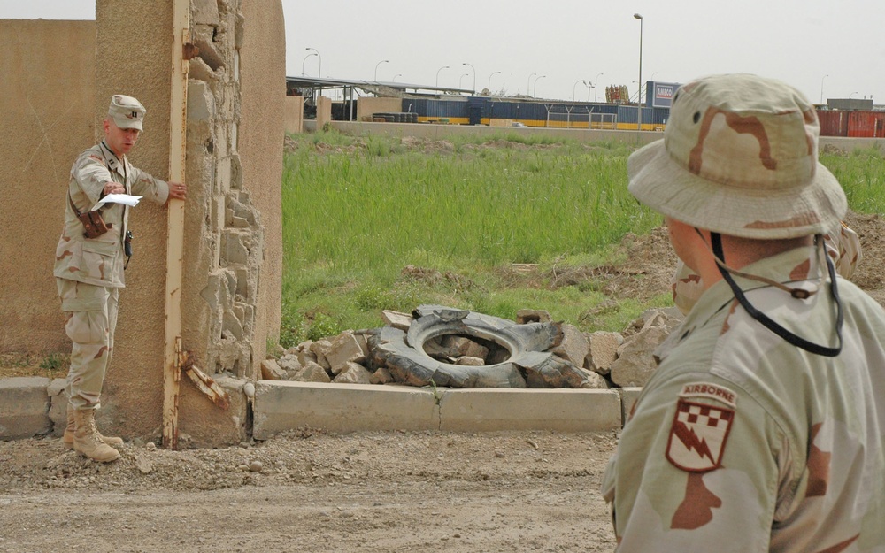 Capt. James B. Cogbill stands at the remains of the gate