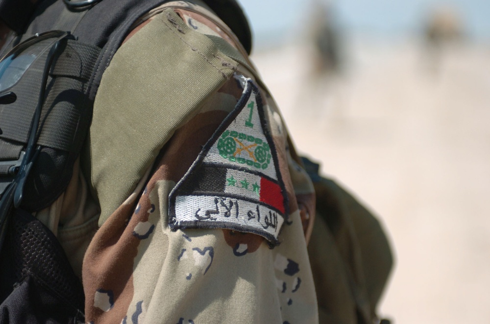 An Iraqi Soldier proudly displays his unit shoulder patch