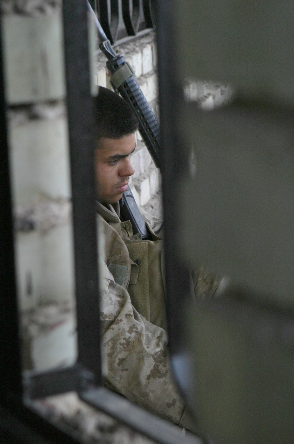 Lcpl. Ryan Rigsby hides from the rays of the sun
