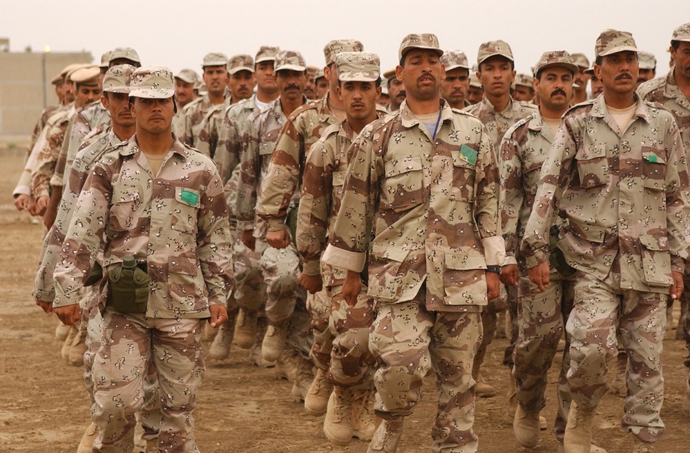 Iraqi Soldiers march in formation while practicing