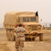 An Iraqi National Guard driving instructor ground guides