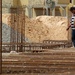 Iraqi contractors examine concrete forms