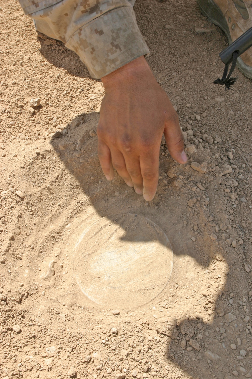 PFC Wollam demonstrates probing and uncovering mines