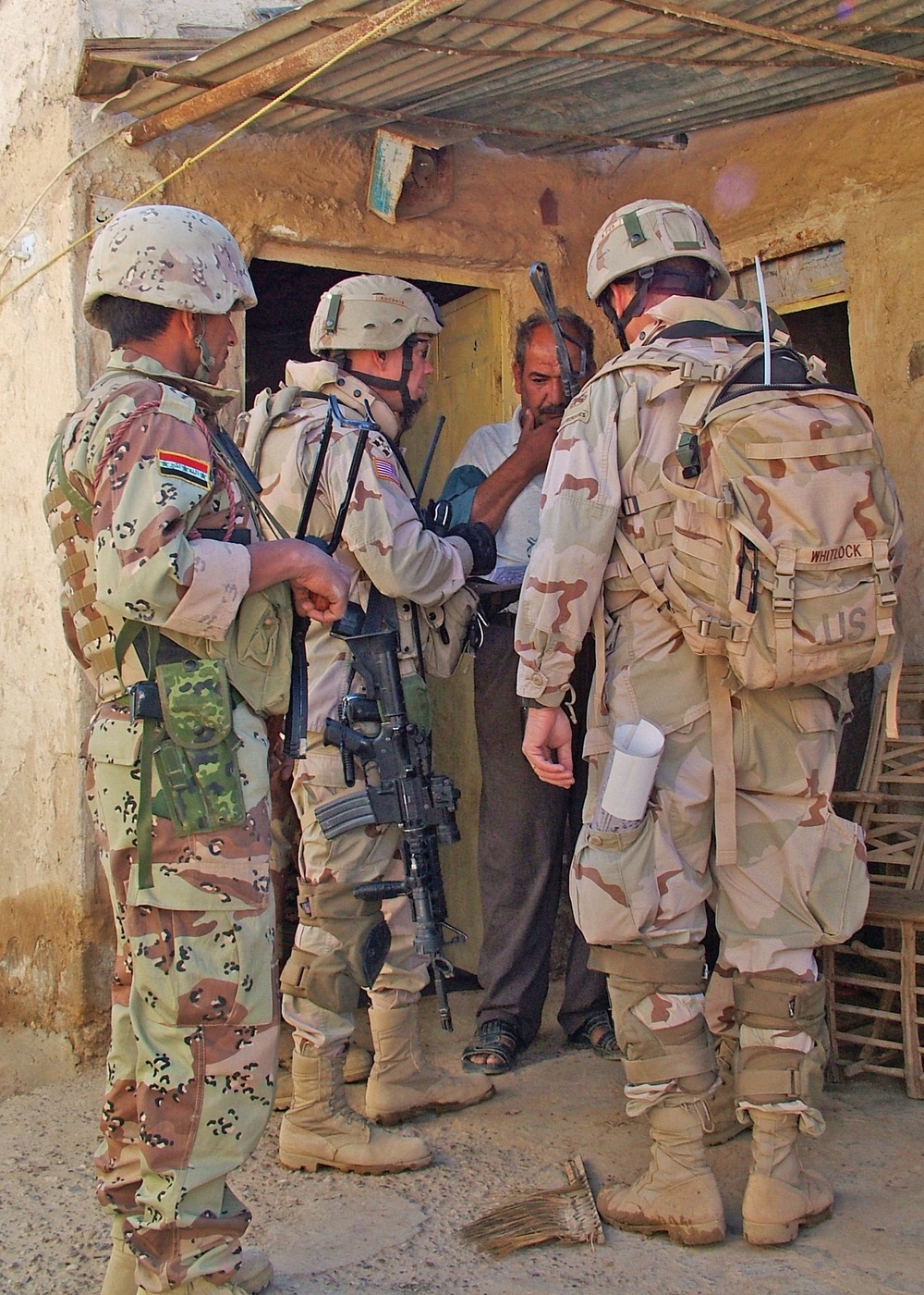 Sgt. Maj. Anthony Cady interviews a local man