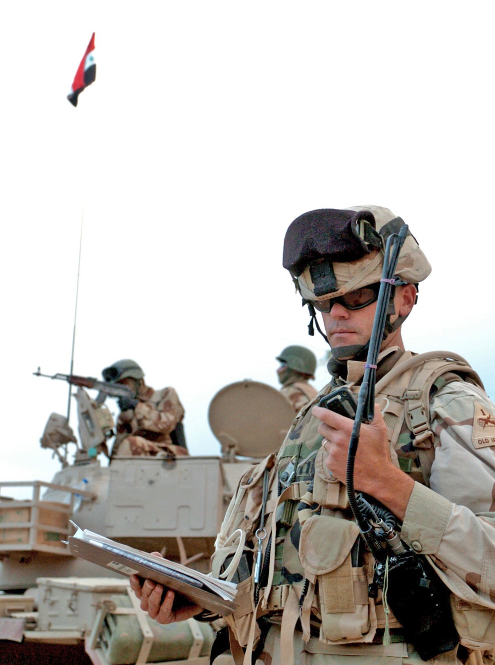 Capt Swenson listens on the radio to monitor