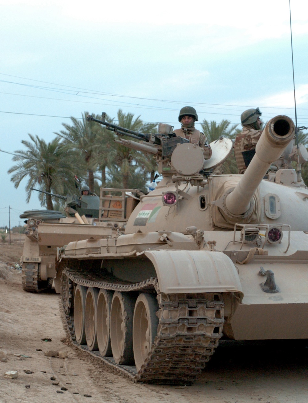 iraqi tank and american 113 provide security