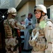 Vargo and iraqi soldier prepare to search a house