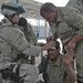 PFC Ringman assist two Iraqi police in proper techniques