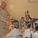 Staff Sgt. Butch A. Drake hands out Beanie Babies