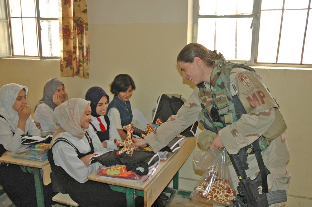 Capt. Whitney Jensen hands out Beanie Babies