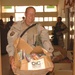 SFC Craig R. Coker heads into a schoolhouse