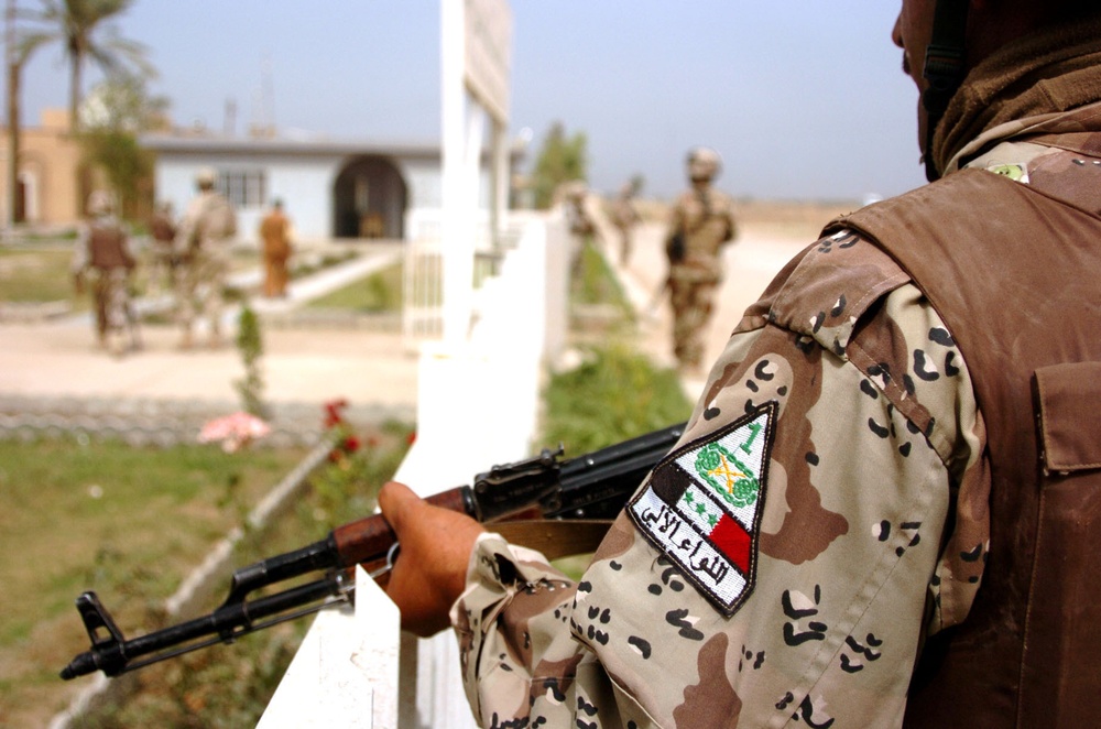 A Soldier proudly wears his unit shoulder patch on patrol