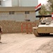 An Iraqi Soldier directs an MTLB armored personnel carrier