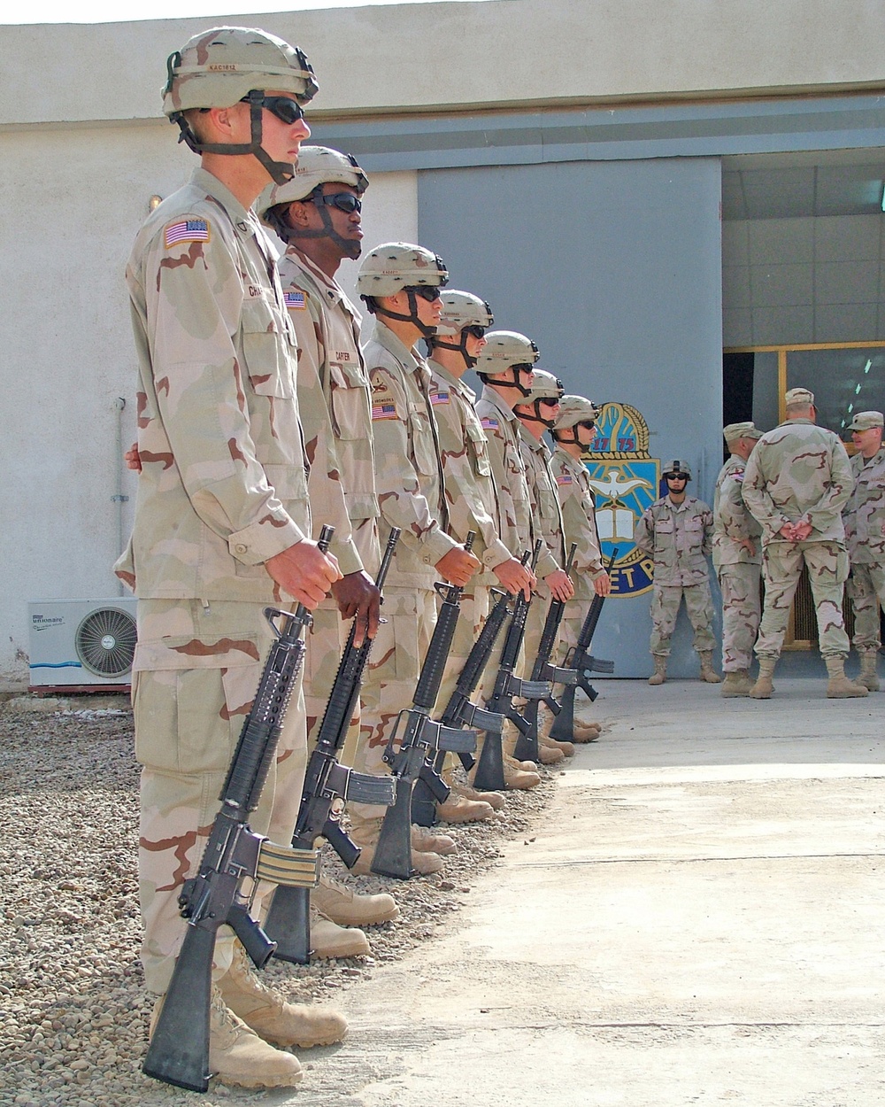 Soldiers stand as an honor guard during a memorial ceremony