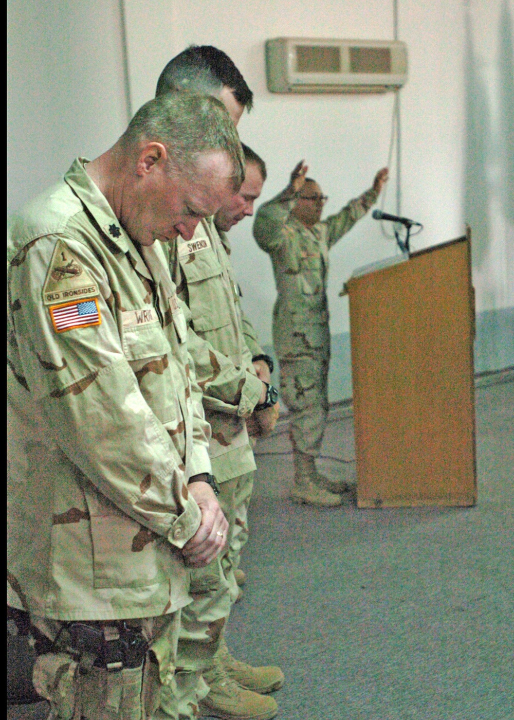 Lt. Col. Anthony Wright bows his head