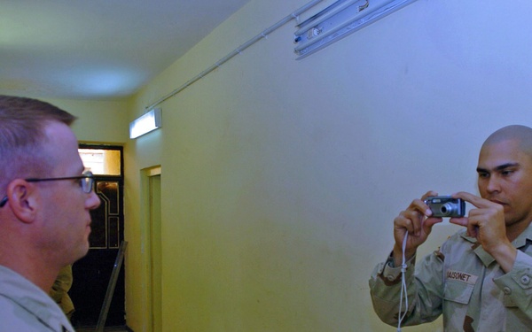 SSgt. Maisonet takes photos to be used in an ISOPREP packet