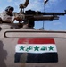 A Soldier pulls security from a tank in Abu Ghraib