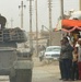 Soldiers patrol the streets of Abu Ghraib