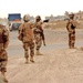 A squad patrols the streets of Abu Ghraib