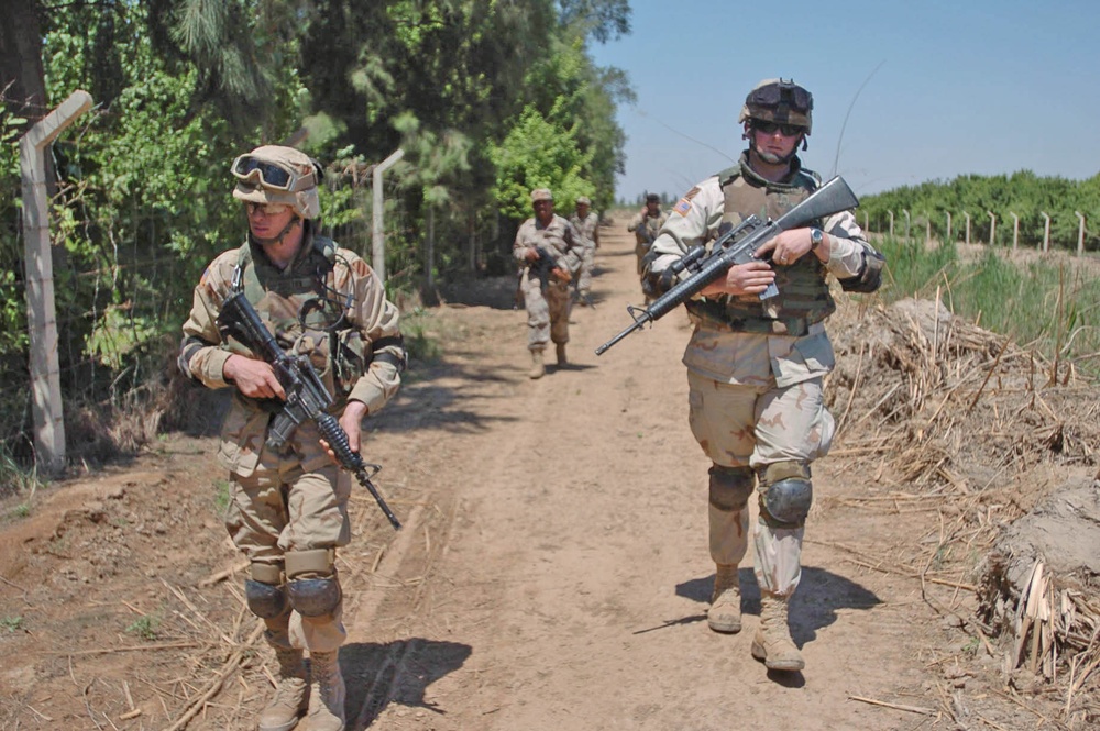 Sgt. Shannon Garstka and Pfc. Mitch Shelton patrol