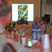 EOD servicemembers watch a slide show