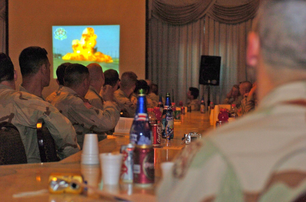 EOD servicemembers watch a slide show