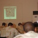 Soldiers take a visual test, identifying the unexploded ordnance