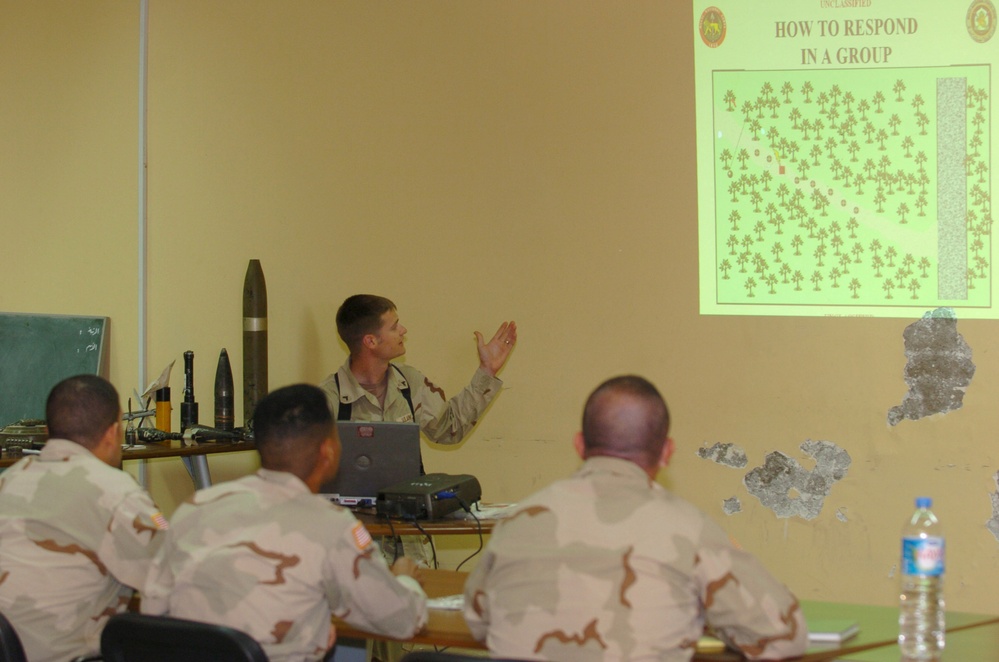 Cpl. Justin Mack gives a block of information about probing