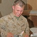 Cpl Jeremy R. Carter works on a damaged Dragon Eye