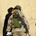 A grateful Iraqi woman thanks a soldier