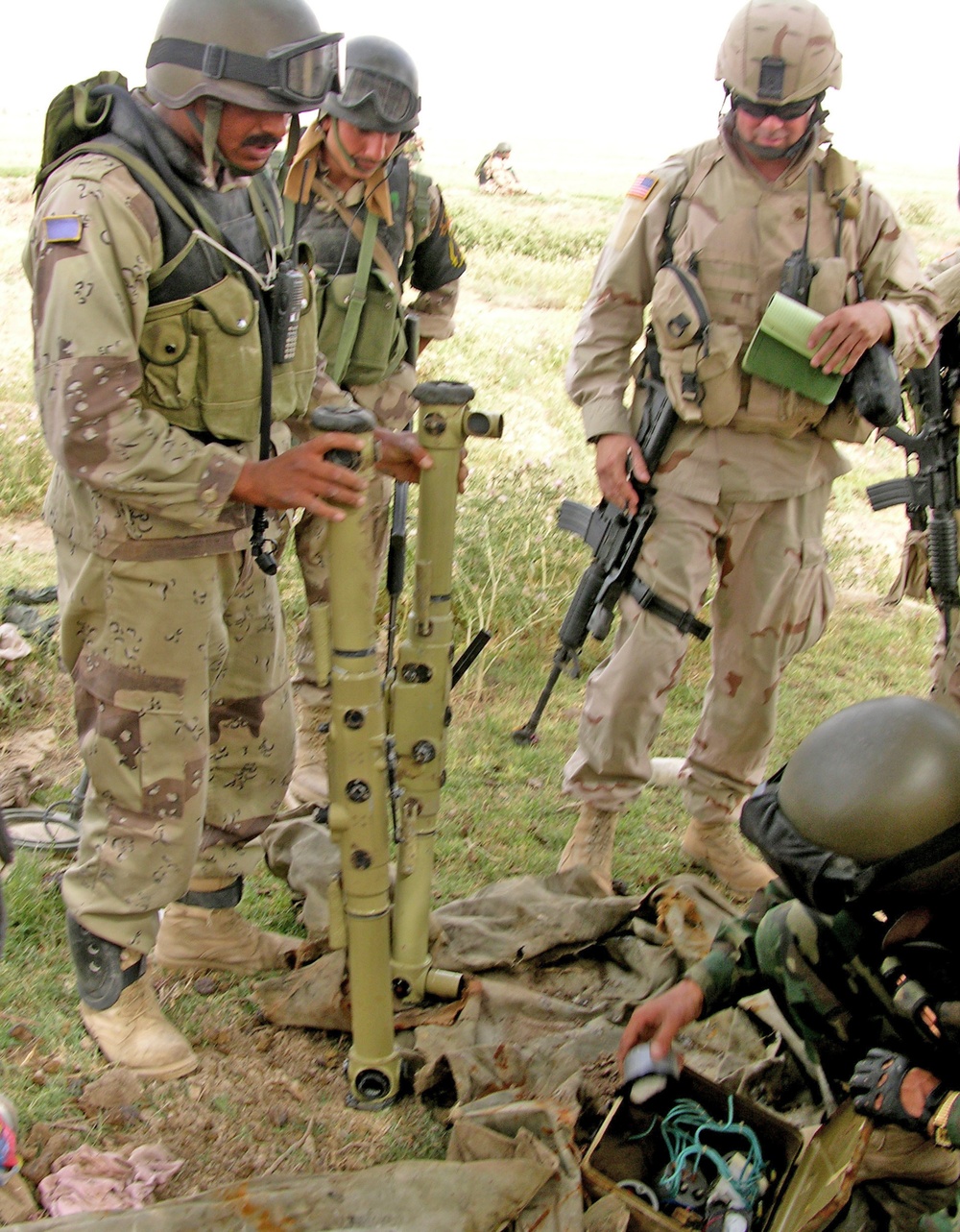 Soldiers find a mortar tripod Maj. Sears looks on