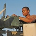 Spc. Groover checks a .50-cal machine gun before convoying