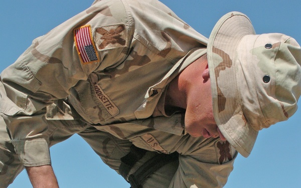 Sgt. Kye Modisette washes the insides of a tank
