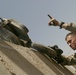 Lance Cpl.Matthew Bailey signals to Marine