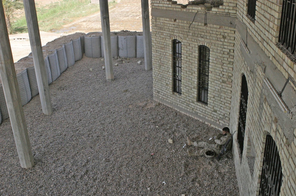 Lance Cpl. Ryan Rigsby hides from the rays of the sun