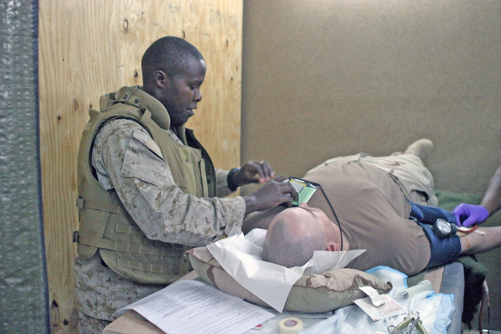 PO 2nd Class Isaac Nyangena comforts a Soldier