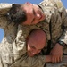 Cpl. Kyle Becker puts his older brother in a headlock