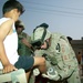 Sgt. Kevin J. Hammer treats a child with a severe burn