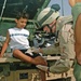 Sgt. Kevin J. Hammer treats a child with a severe burn