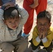 Two Iraqi boys stop to pose for the camera