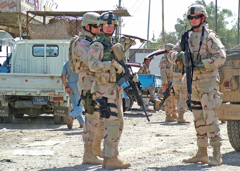 Sgt. Chris Ford and Sgt. 1st Class Tom Roach patrol