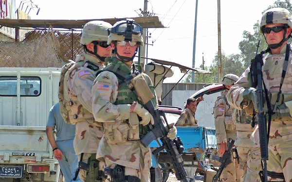Sgt. Chris Ford and Sgt. 1st Class Tom Roach patrol