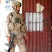 Sgt. 1st Class Bill Riel patrols a market in Taji