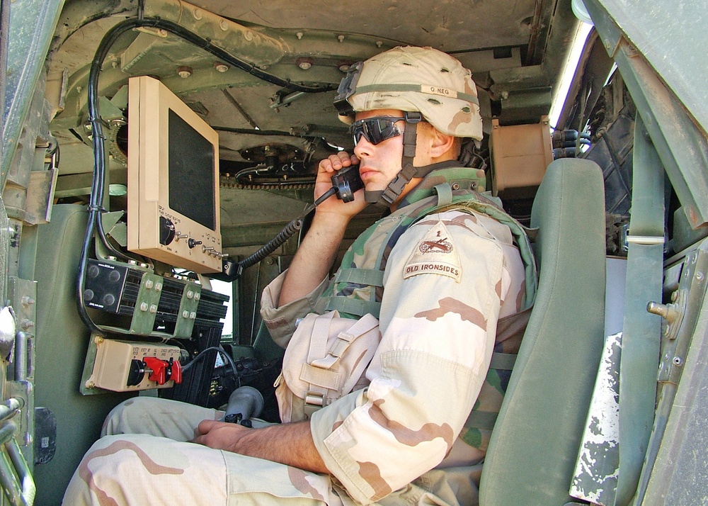 Pvt. William Davenport monitors the radio