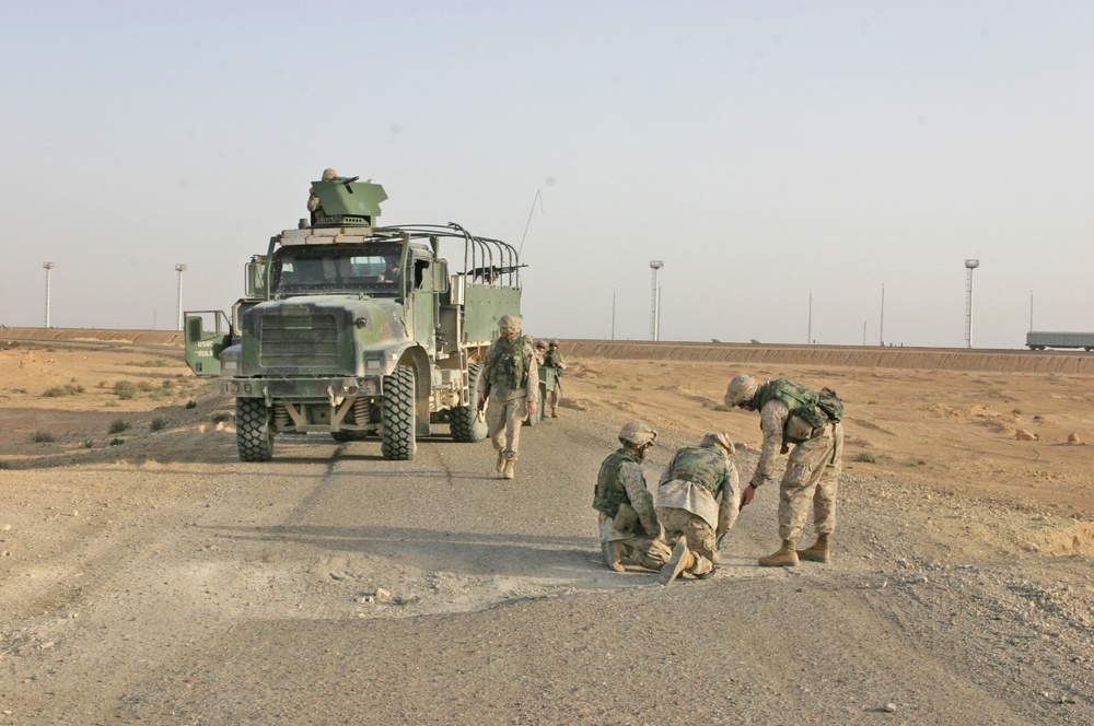 Marines inspect a crater in Western Iraq recently