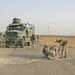 Marines inspect a crater in Western Iraq recently