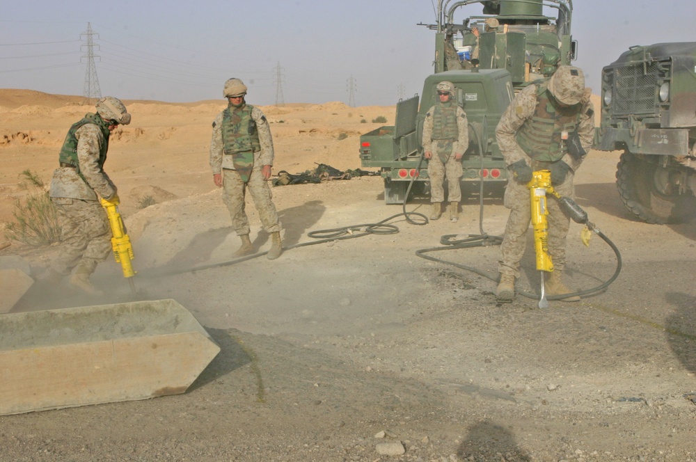 Marines use shovels and jackhammers