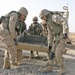 Marines pour concrete into a crater in Western Iraq recently