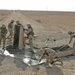 Marines repair a crater in a Western Iraqi road recently